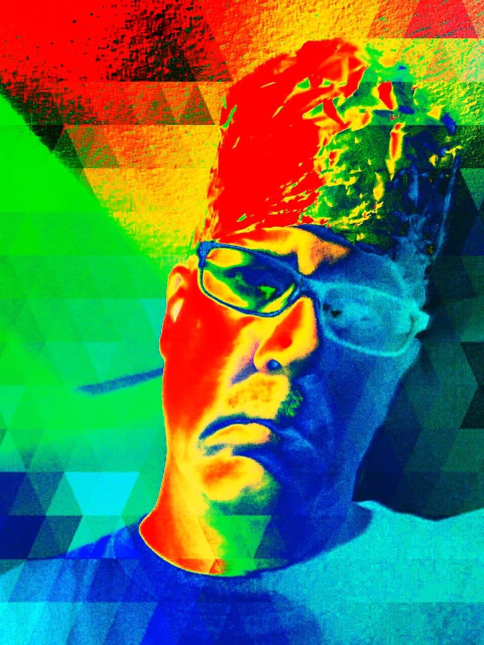 a man wearing glasses and a hat