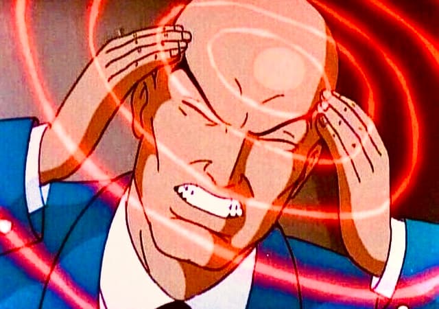 a man in a suit is holding his head in his hands